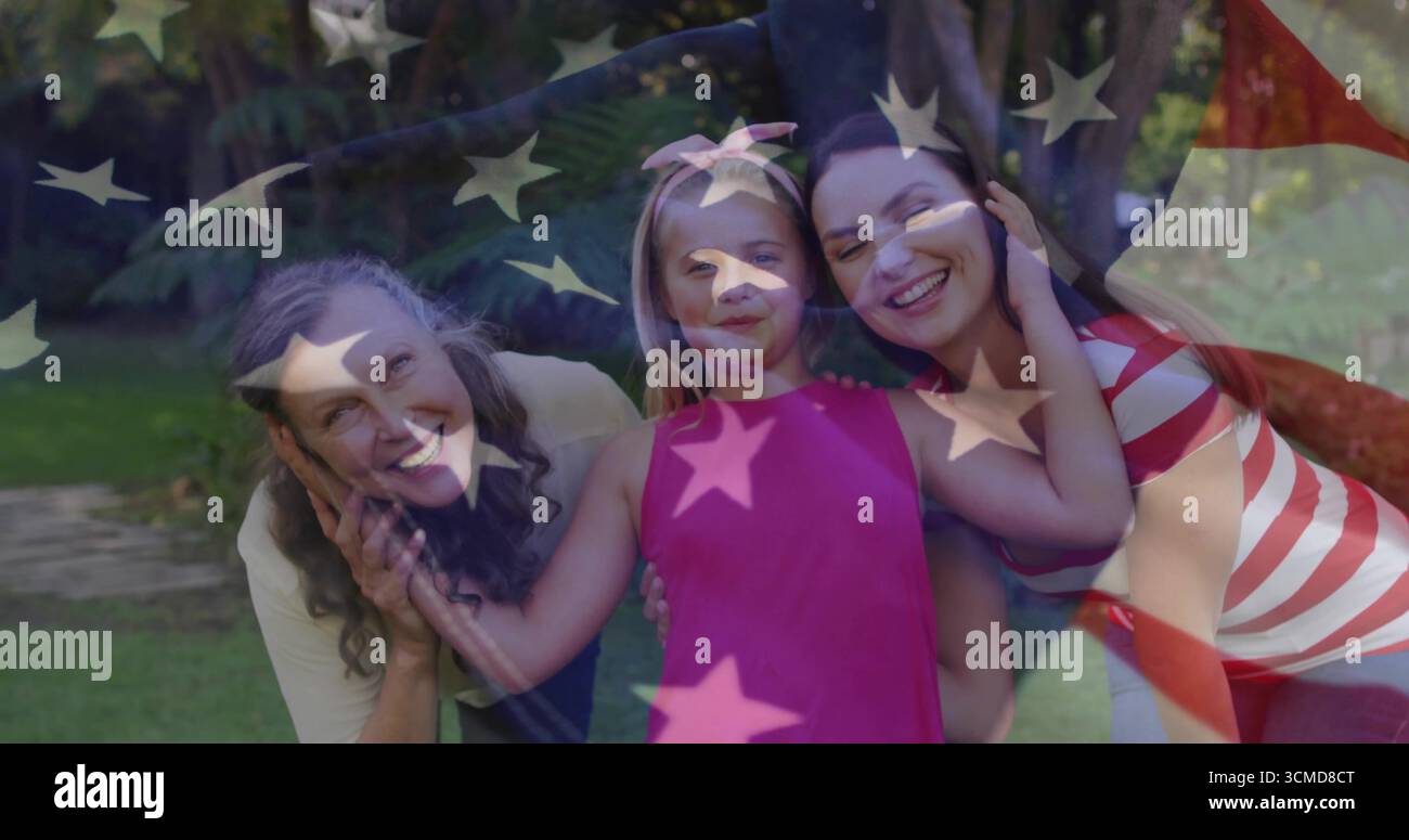 Smiling three generation family wearing pink dress, leaning close in ...