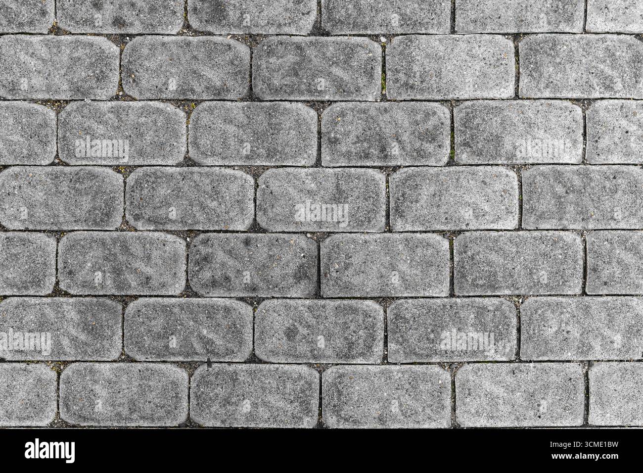 Stone paved street, view from above. Beautiful background. Stone pavement texture. Stock Photo
