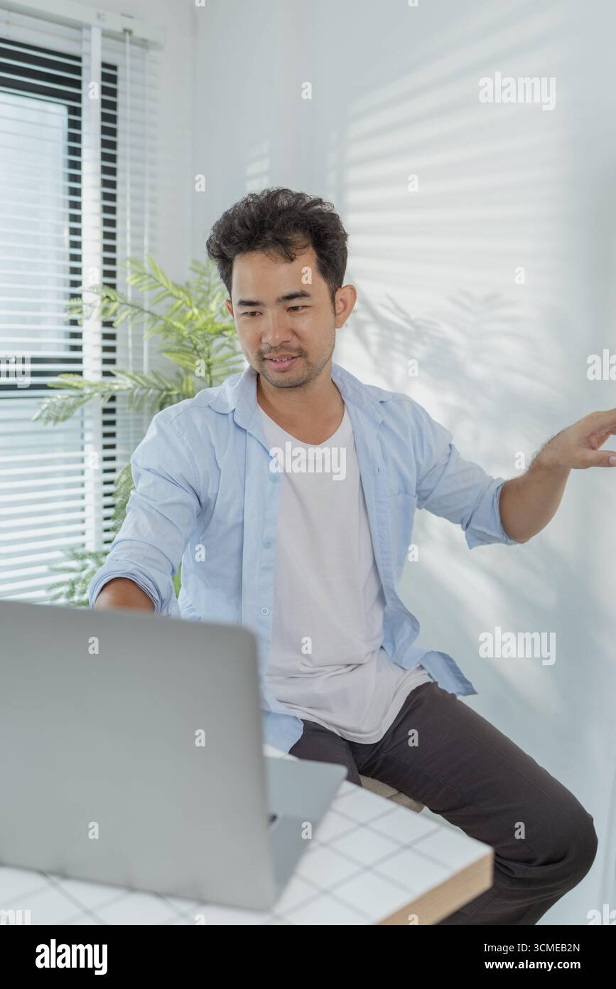 A young designer is working on a UX UI project, analyzing mobile app ...