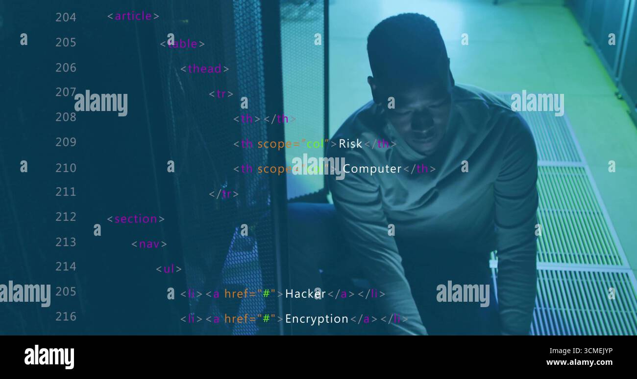 Kneeling IT technician inspecting server rack in data center, with cables and HTML tags, copy space Stock Photo
