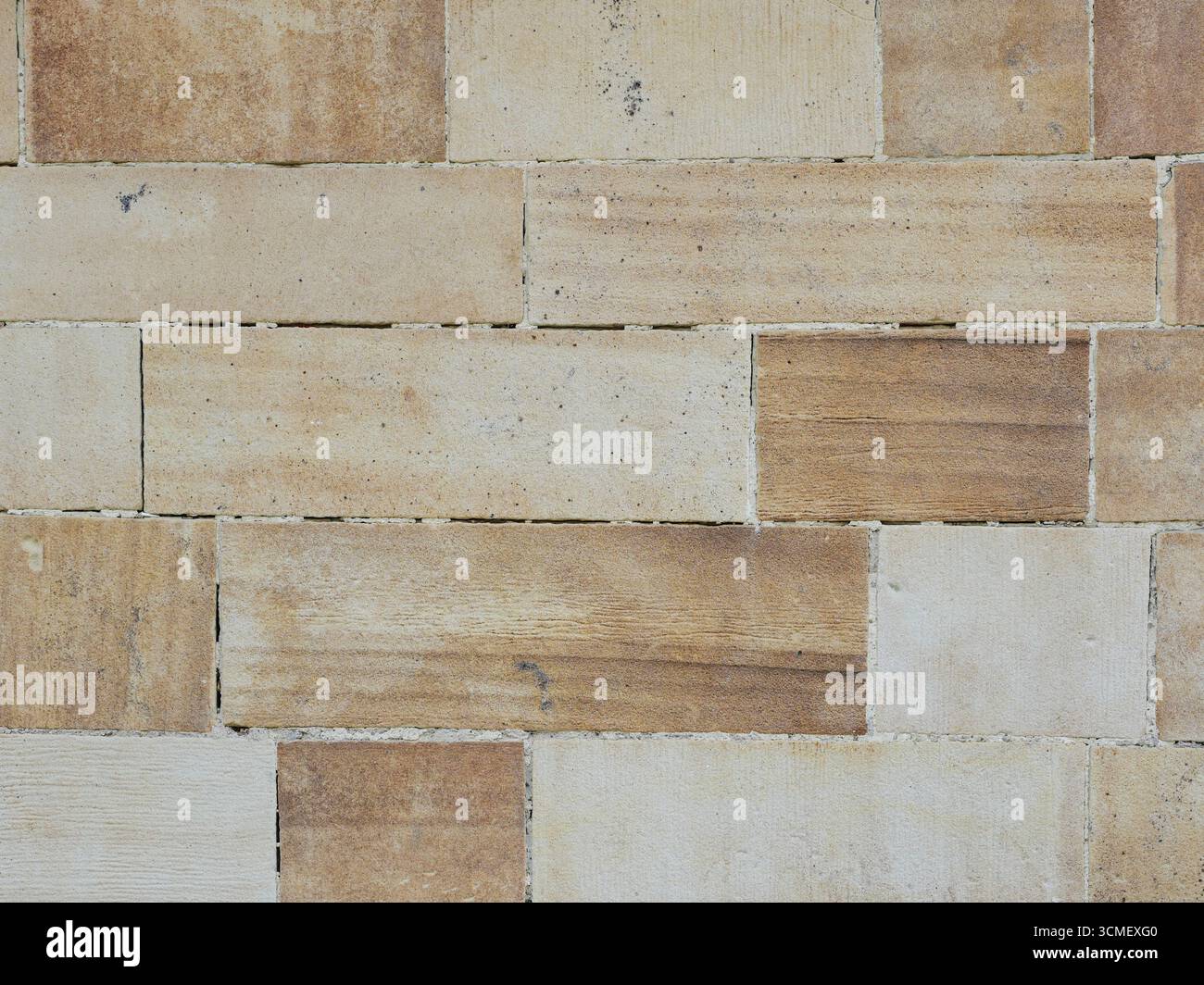Sandstone facade with rectangular stones, grain, rough surface and horizontal pattern. Close-up. Copyspace. Stock Photo
