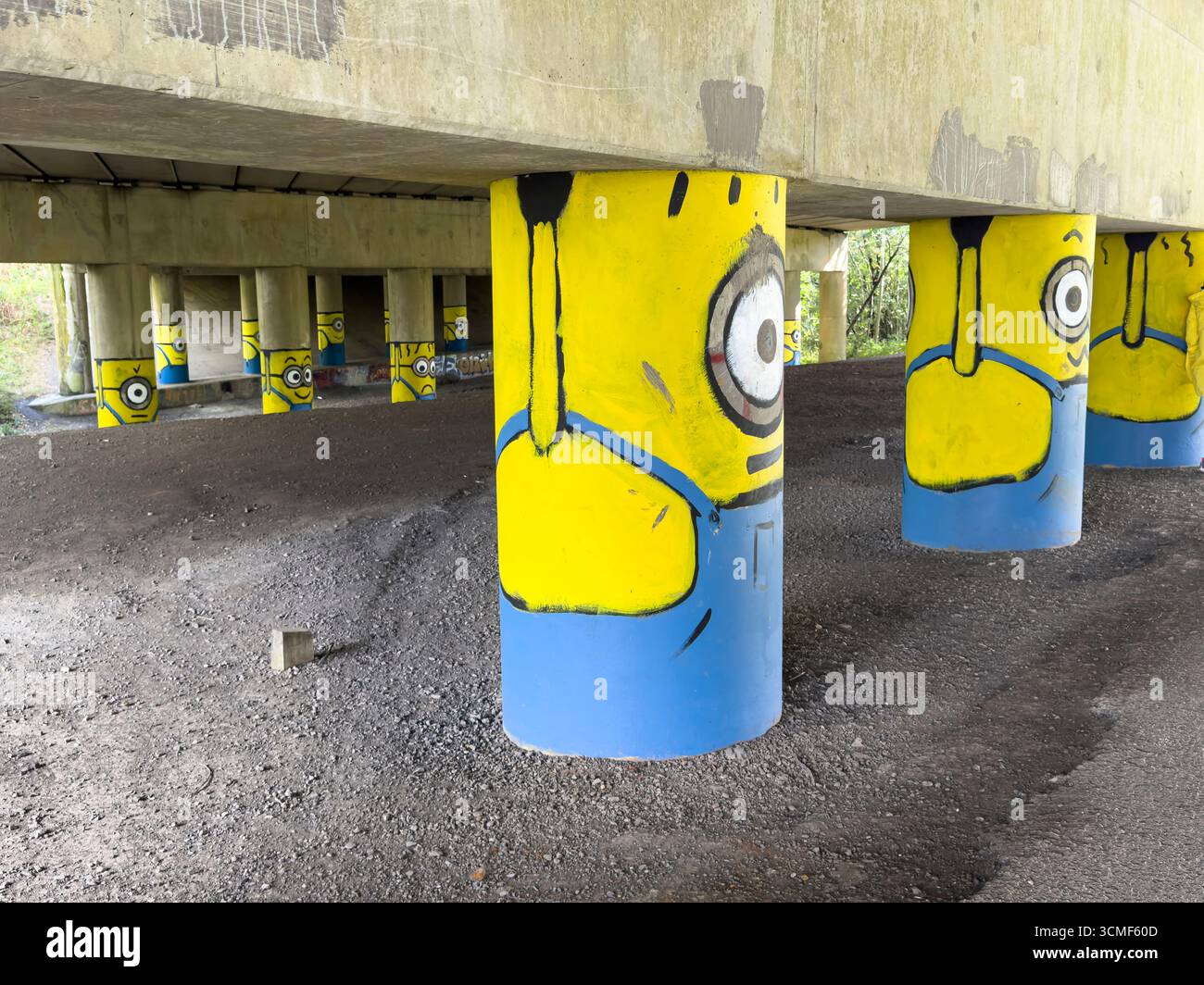 'Burnley Banksy' Minions on the motorway stanchions under the M65 near Hapton, Burnely, Lancashire - Smartphone Captured Stock Image