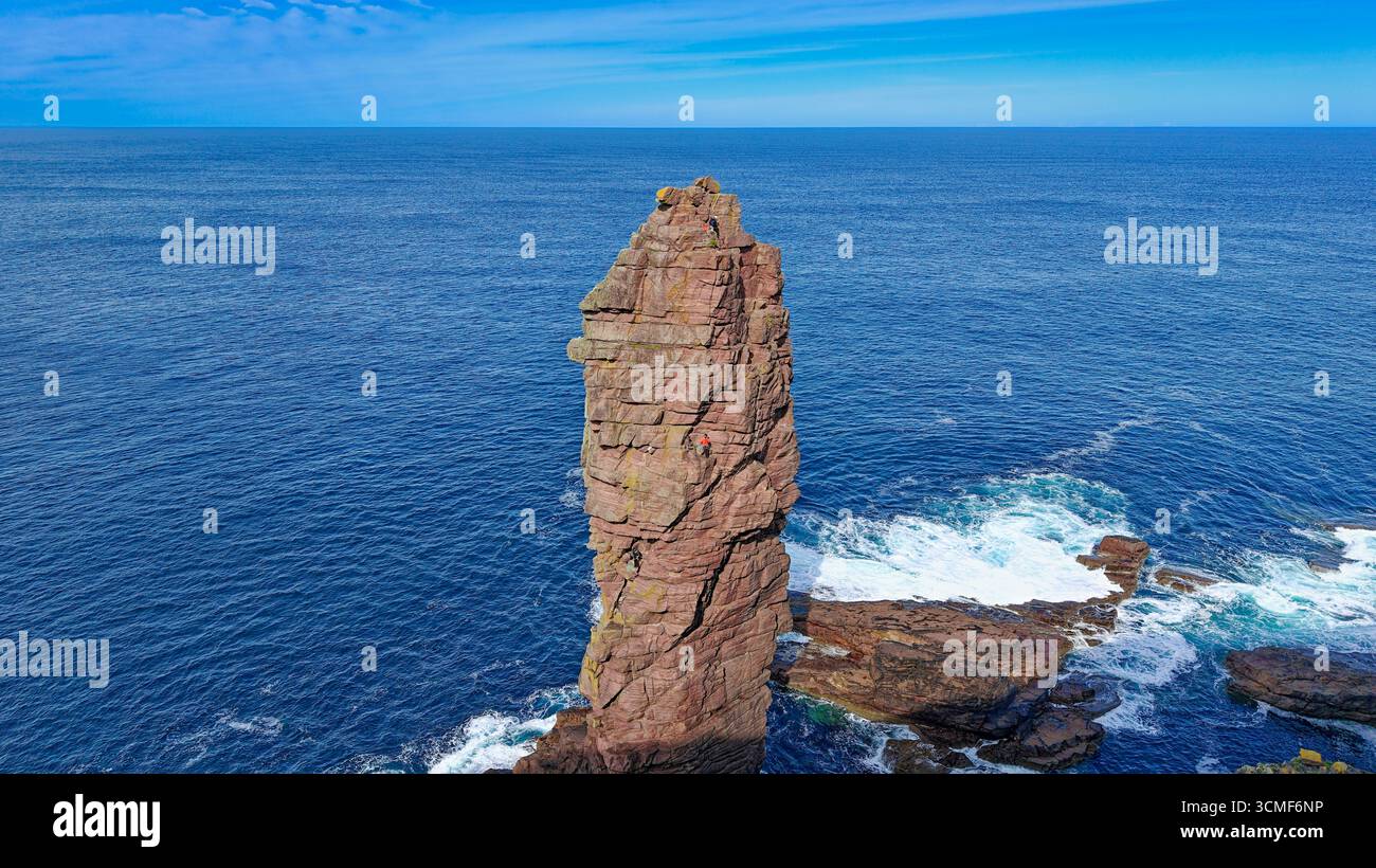 Old Man of Stoer Sutherland Scotland 200 ft sandstone sea stack a climber near the summit Stock Photo