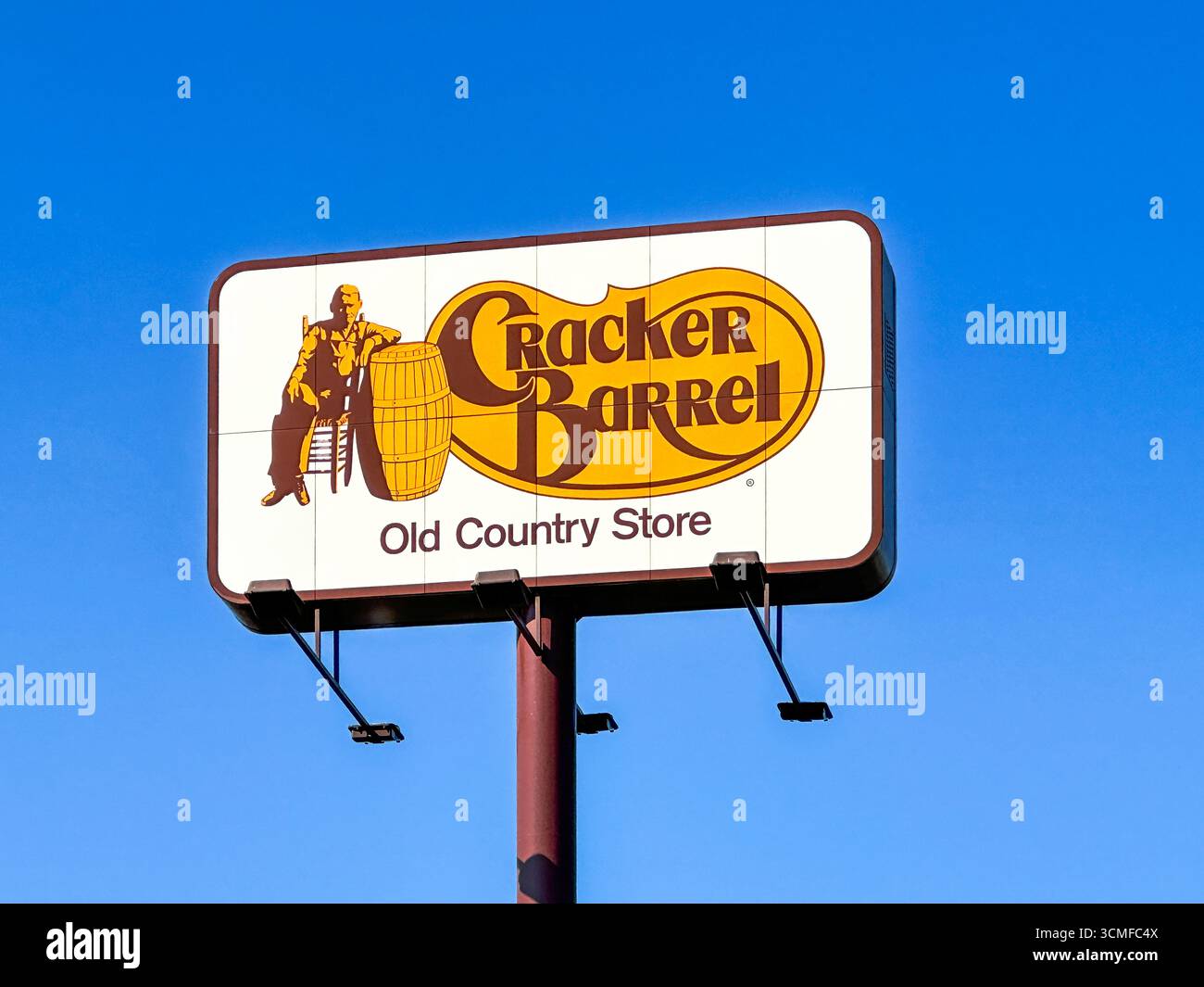 Cracker Barrel Old Country Store sign against blue sky. Hobart, IN USA - Smartphone Captured Stock Image