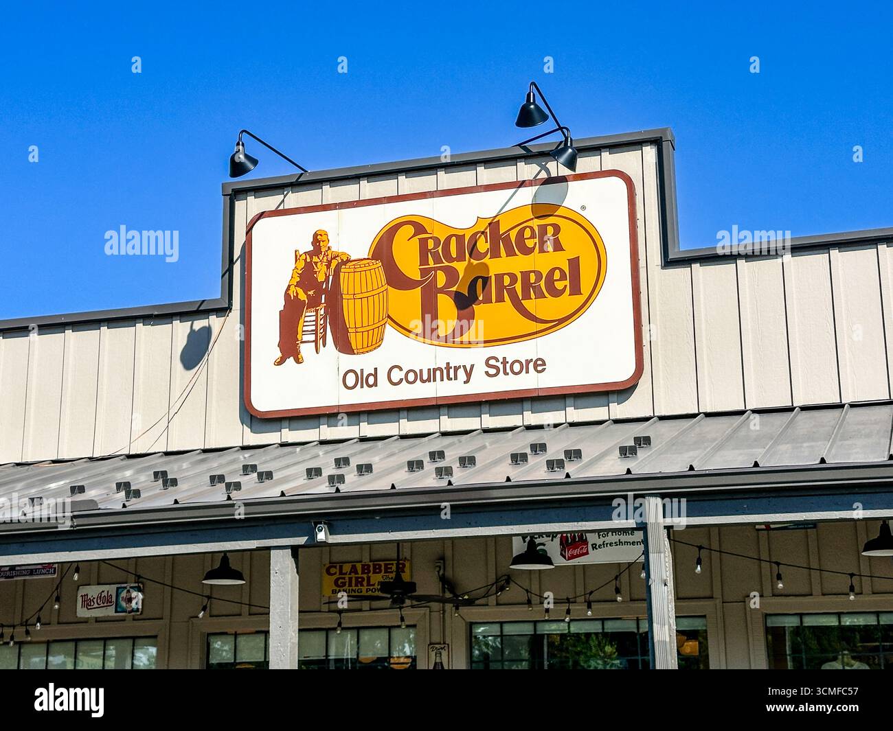 Cracker Barrel sign on the exterior of a Cracker Barrel restaurant against blue sky, Hobart, IN Sept 14, 2025 - Smartphone Captured Stock Image