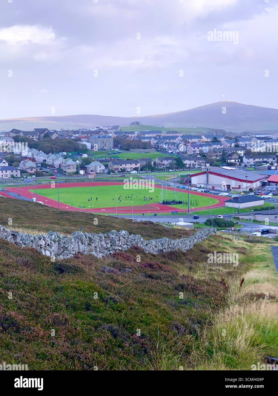 Shetland islands airport runway plane landing Lerwick  tail road hills road sign lamb sheep water sea heather shore mountains mountain path people - Smartphone Captured Stock Image