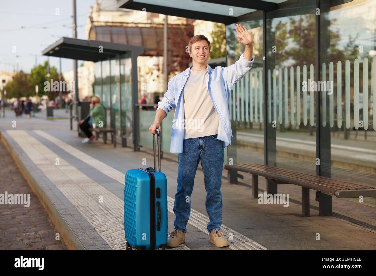 Goodbye Stop Young woman leaving bus stop hi-res stock photography and images - Alamy