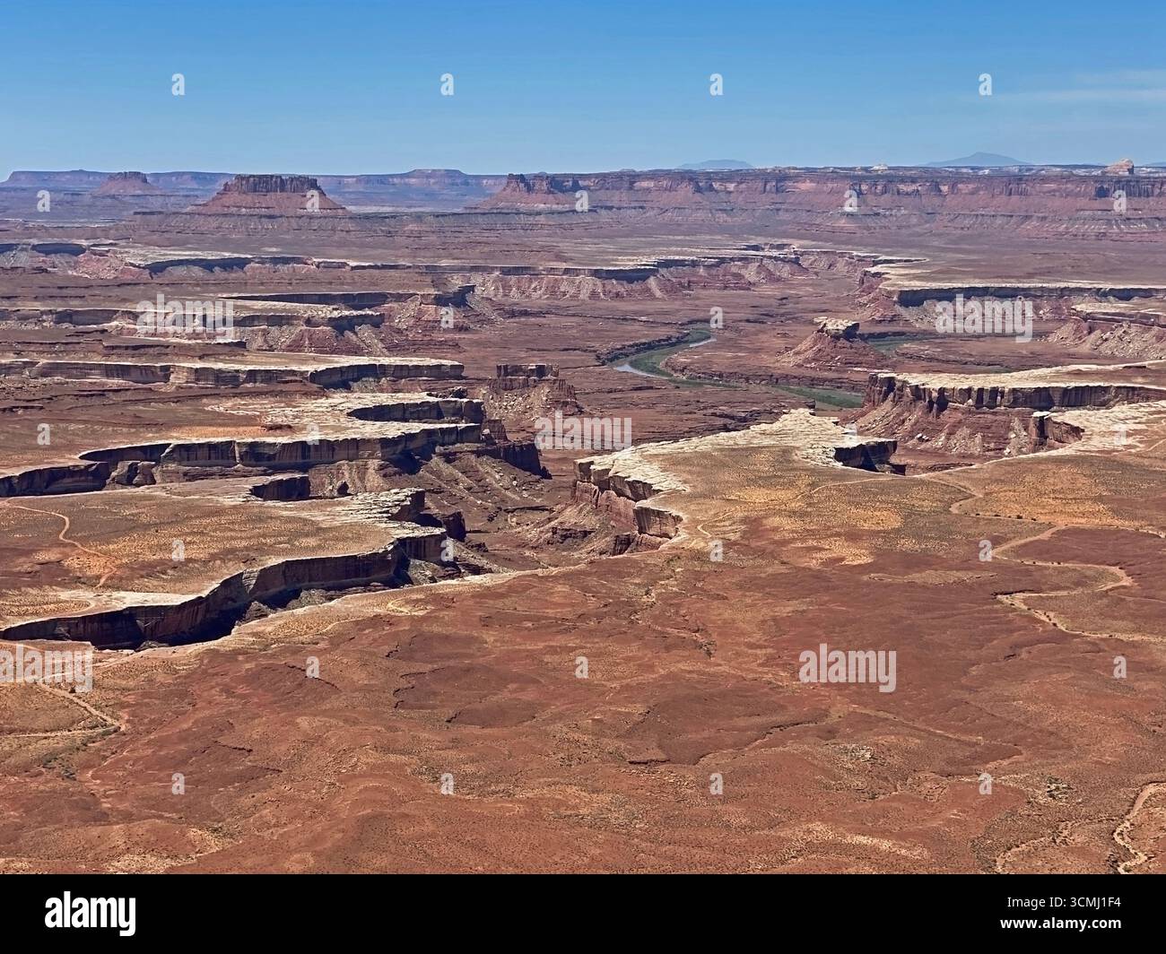 A sweeping landscape view from Green River Overlook, looking down into the canyon and Green River on the vally floor,  in the vast high desert in Cany - Smartphone Captured Stock Image