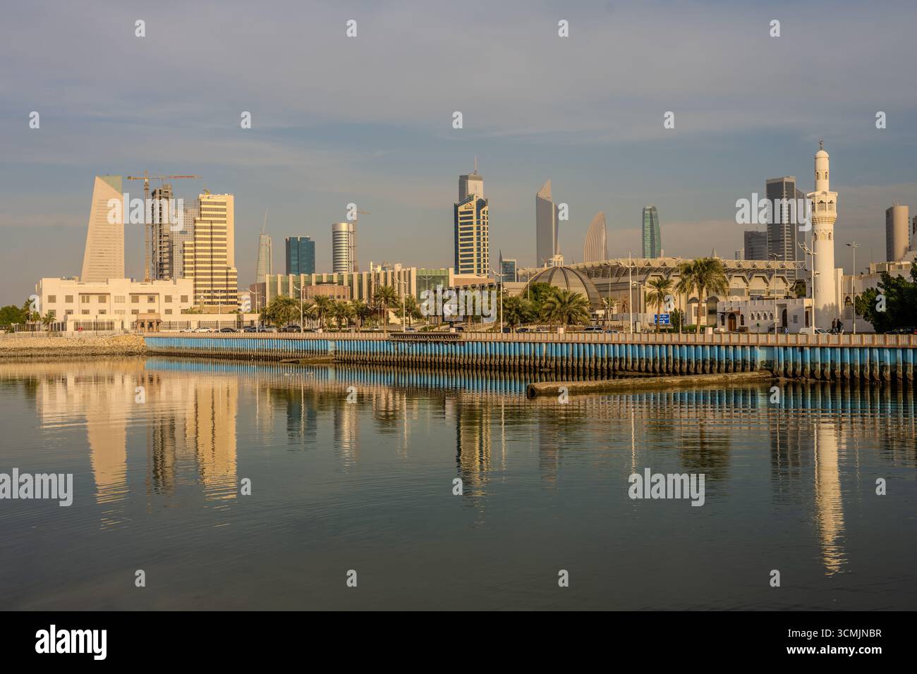 Daytime view of Kuwait City skyline with modern skyscrapers reflecting ...