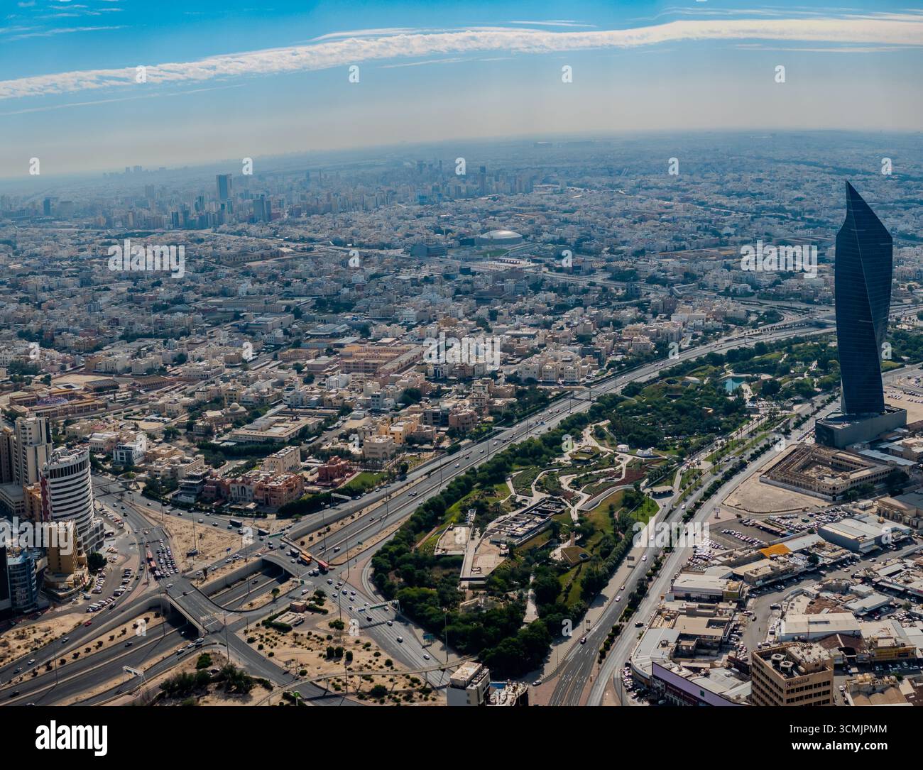 Kuwait Building View Aerial view of Kuwait City featuring the Tijaria Tower, a distinctive ...