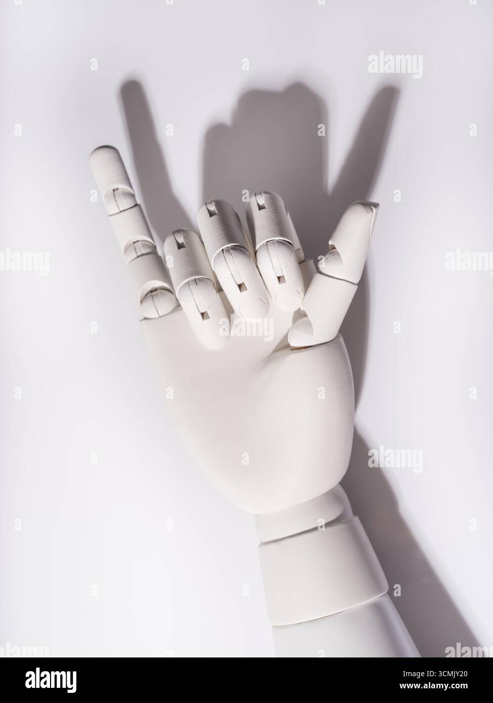 The robot's hand is on a white background Stock Photo