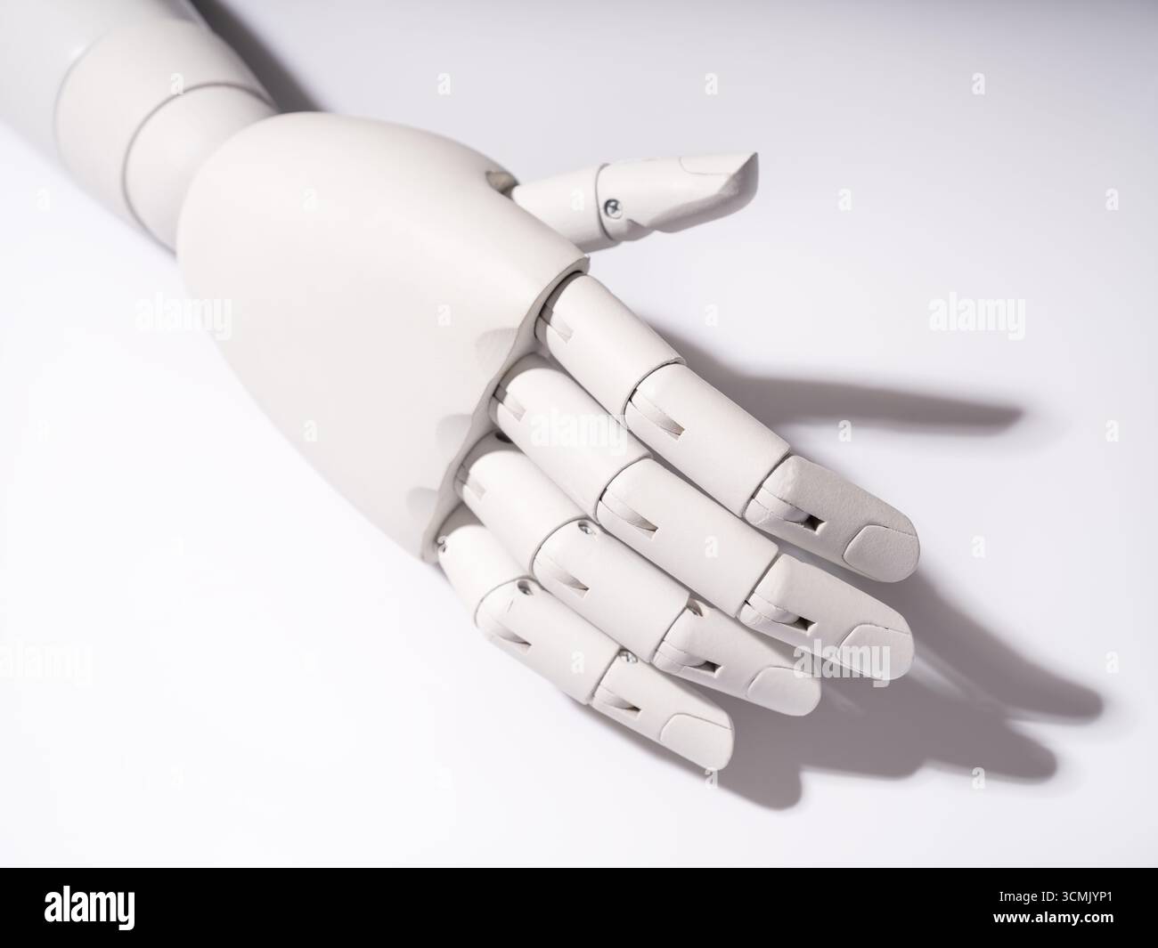 The robot's hand is on a white background Stock Photo