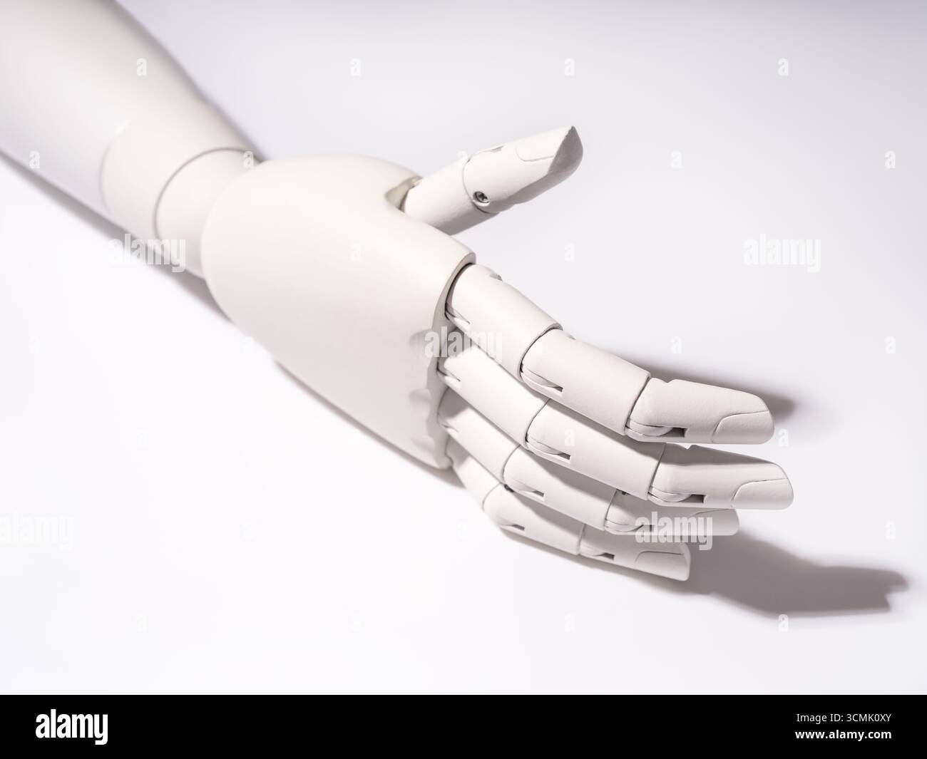 The robot's hand is on a white background Stock Photo
