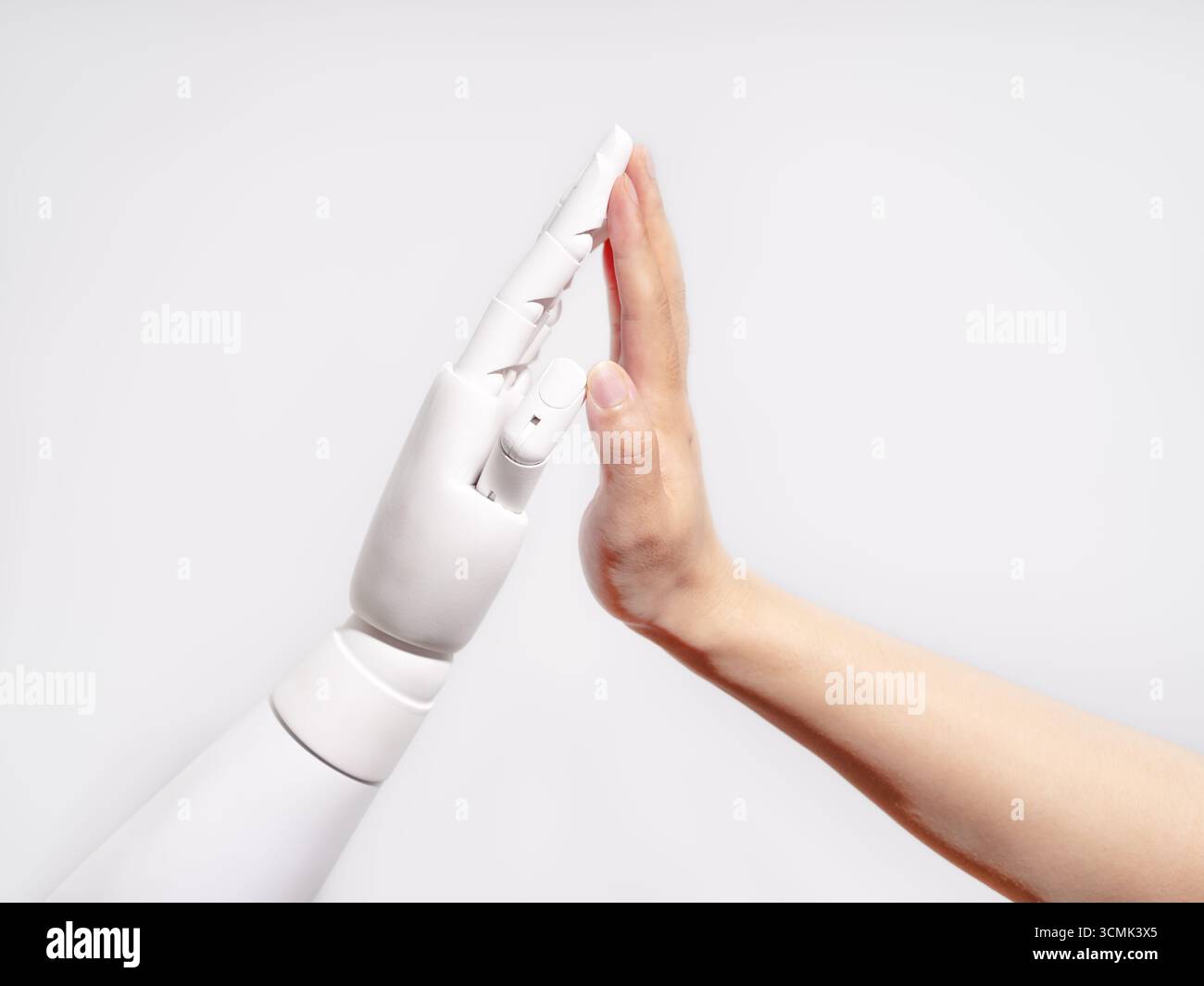 Human and robot hands touching Stock Photo