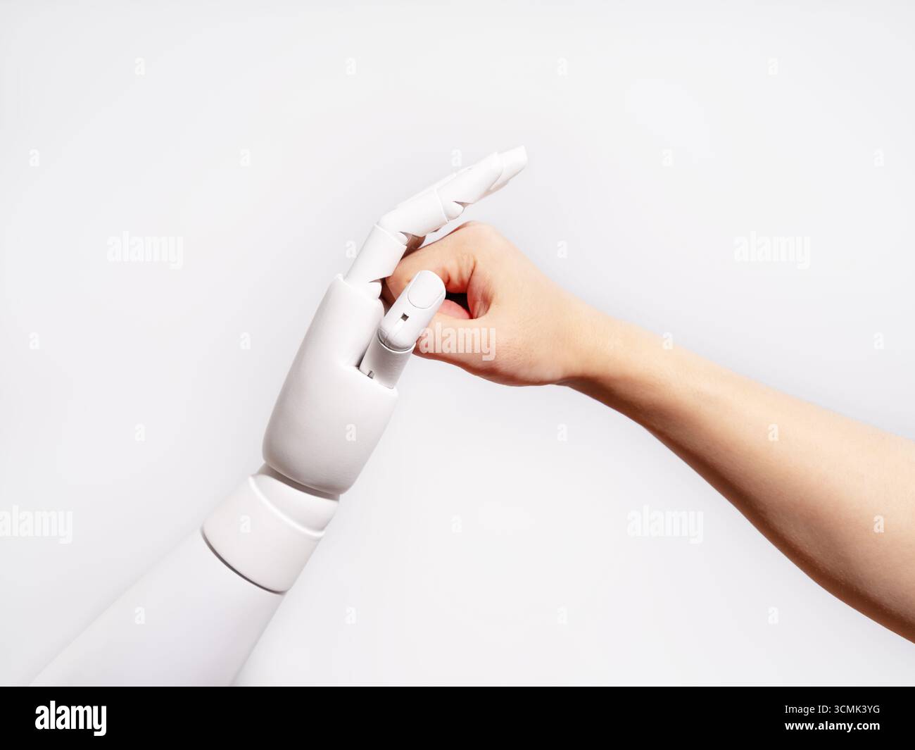 Human and robot fingertips touching Stock Photo
