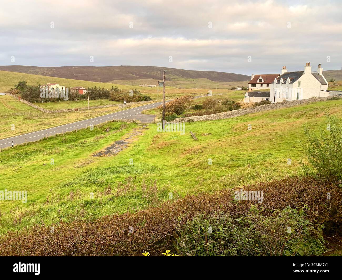 Shetland islands airport runway plane landing Lerwick  tail road hills road sign lamb sheep water sea heather shore mountains mountain path people - Smartphone Captured Stock Image