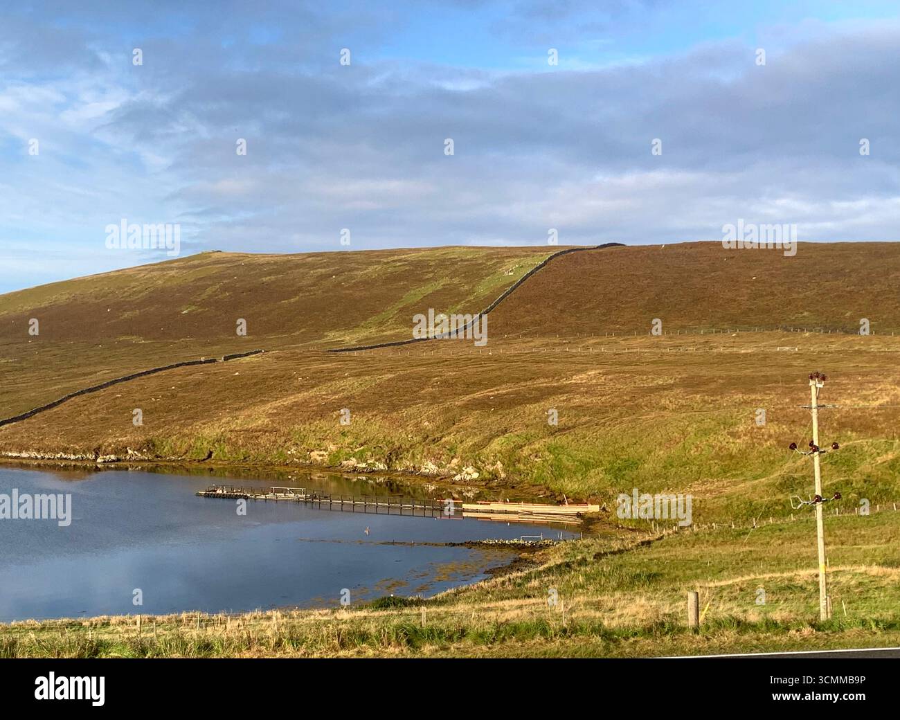 Shetland islands airport runway plane landing Lerwick  tail road hills road sign lamb sheep water sea heather shore mountains mountain path people - Smartphone Captured Stock Image