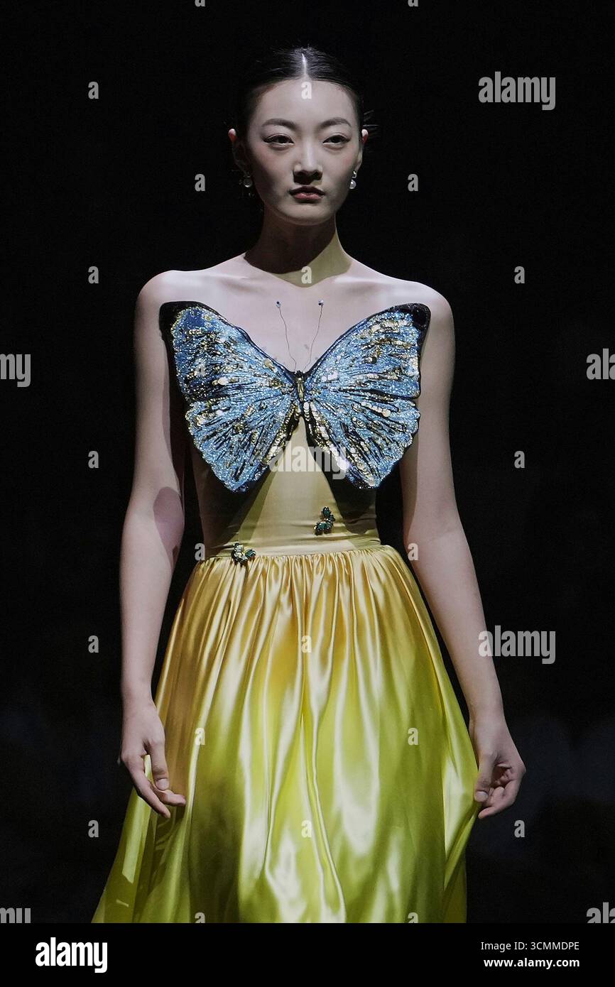 A model showcases a creation from the Lijin collection by Rong He ...