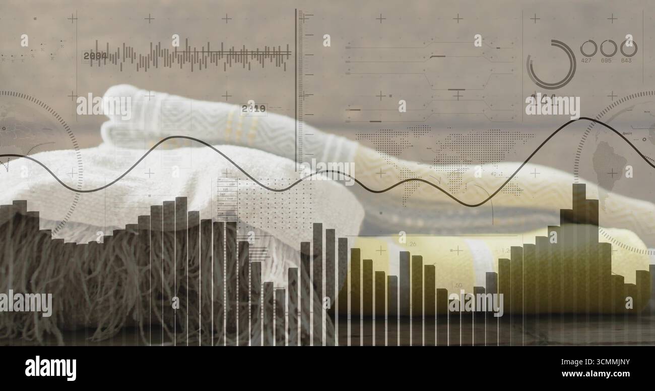 Displaying folded knit blankets with cable pattern resting on wooden tabletop, data charts overlay Stock Photo