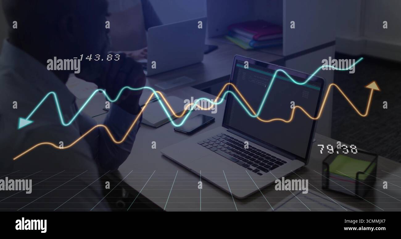 Businessman studying coded data on laptop at office, with line-graph overlay, copy space Stock Photo