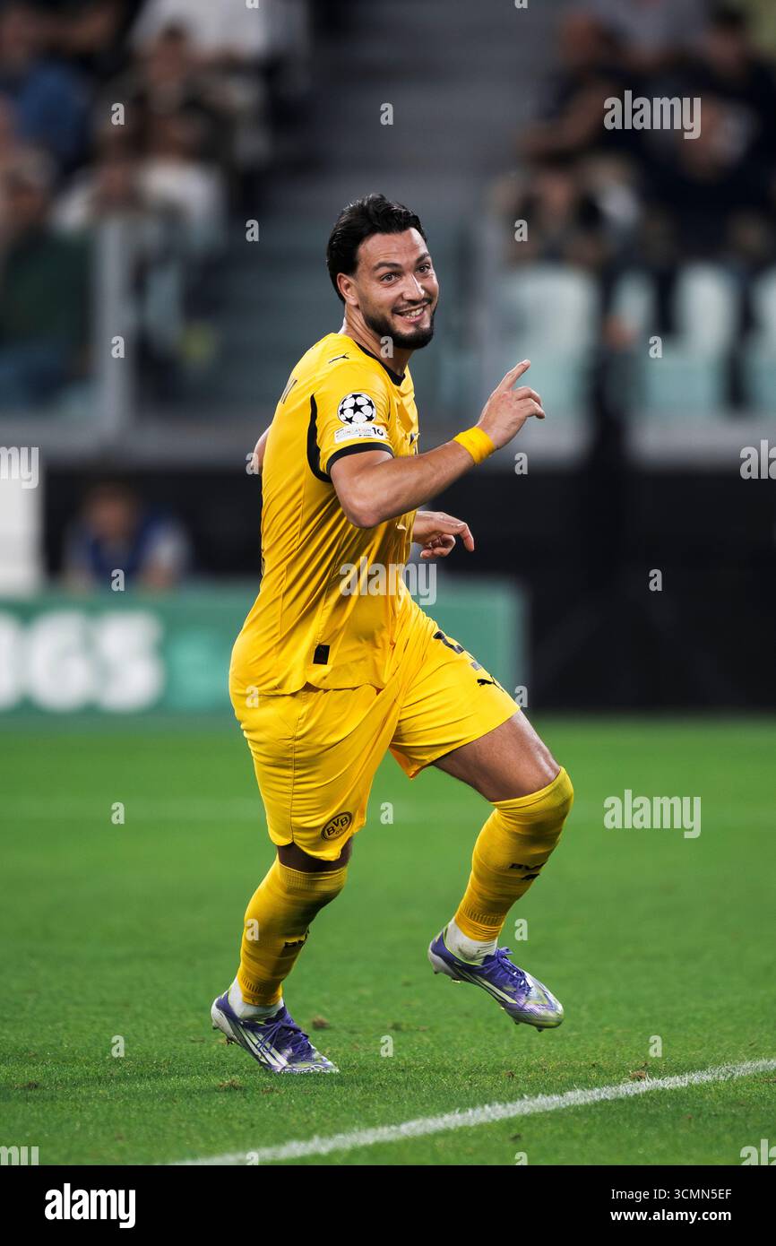 ramy-bensebaini-of-borussia-dortmund-celebrates-after-scoring-a-goal