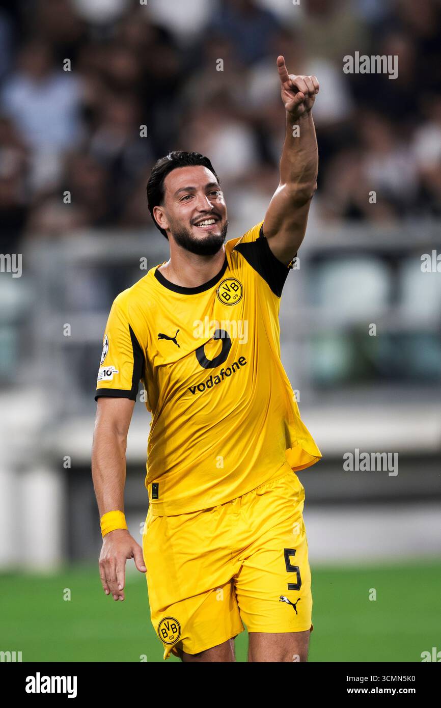 ramy-bensebaini-of-borussia-dortmund-celebrates-after-scoring-a-goal