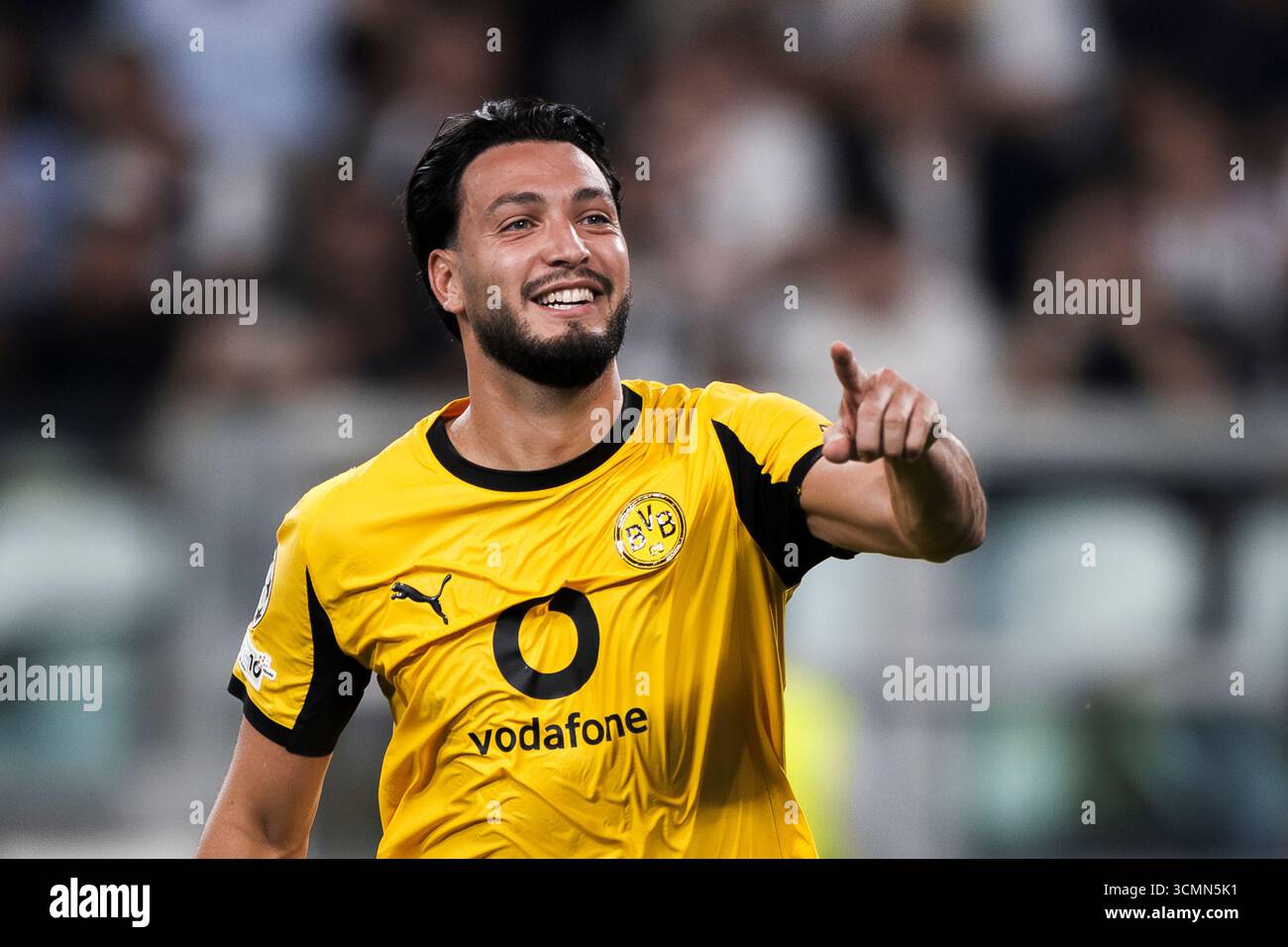 ramy-bensebaini-of-borussia-dortmund-celebrates-after-scoring-a-goal