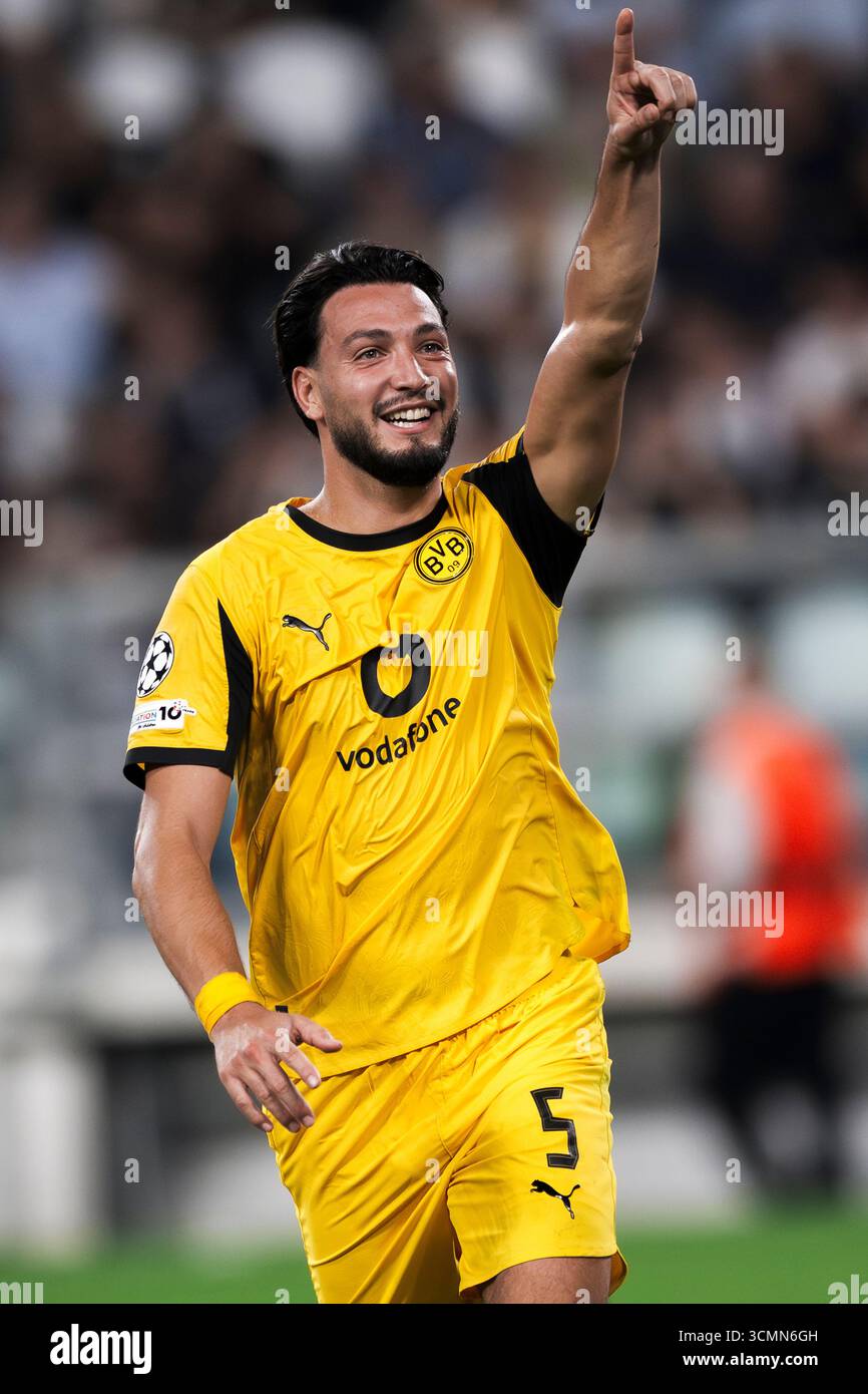 ramy-bensebaini-of-borussia-dortmund-celebrates-after-scoring-a-goal