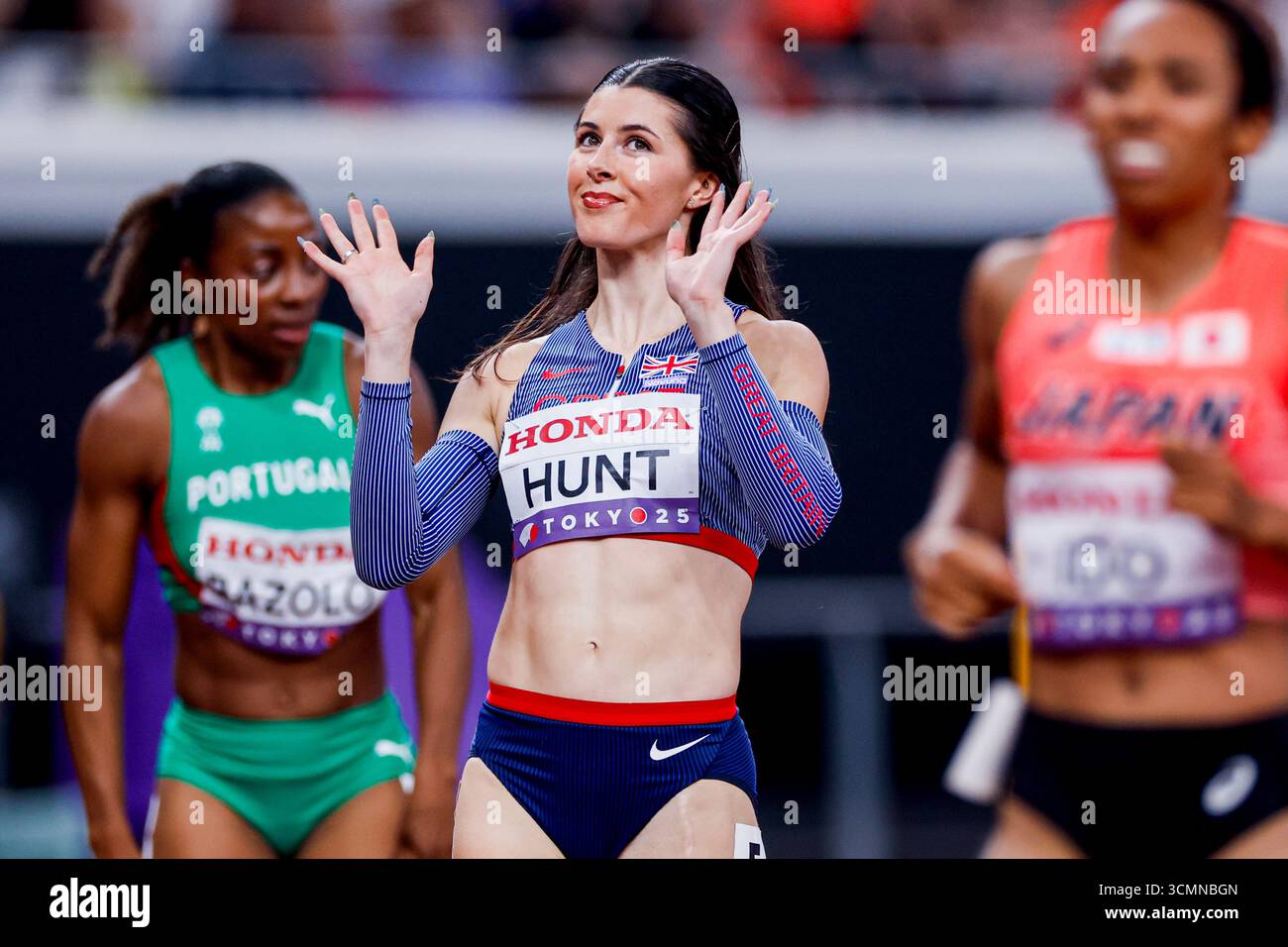Amy Hunt of Great Britain wave after competing in the Men's Javelin ...