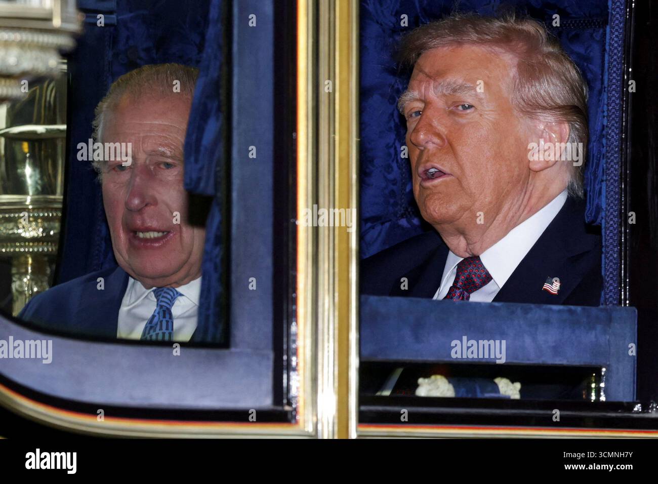 Britain's King Charles, left, and President Donald Trump sit in a ...