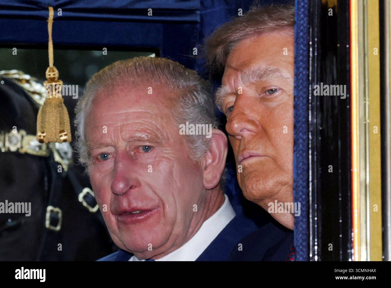 Britain's King Charles, left, and President Donald Trump sit in a ...