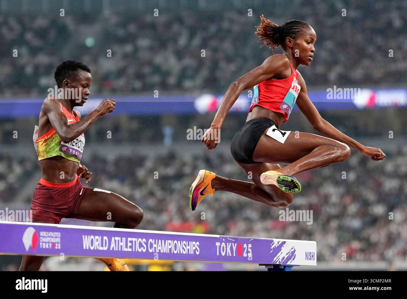Bahrain's Winfred Yavi, right, races in the women's 3,000 meters ...