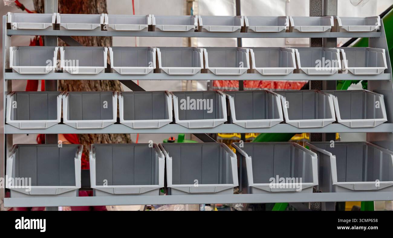 Empty plastic box container crates organizer on a shelf Stock Photo