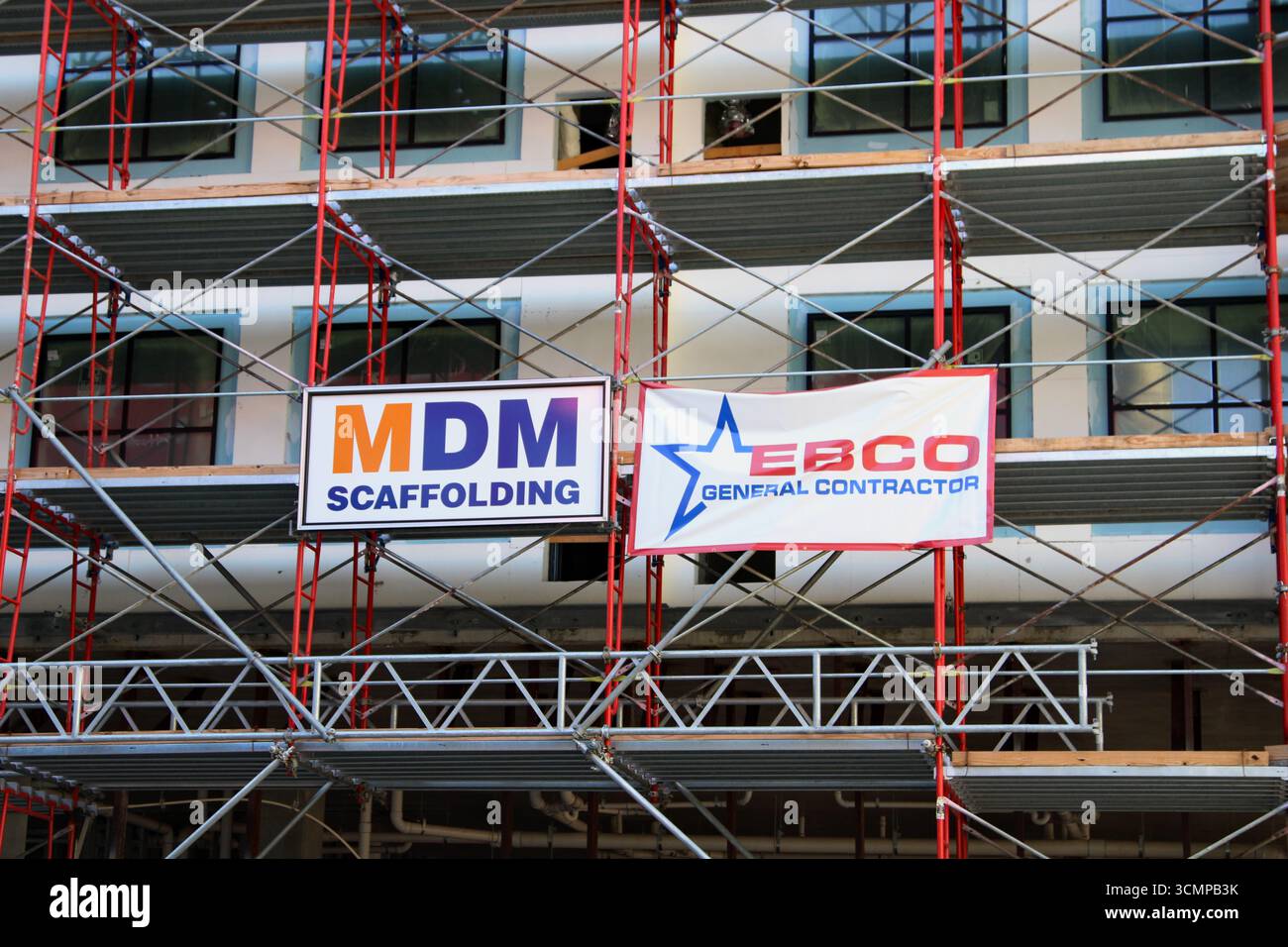 A close up view of a MDM Scaffolding and a EBCO General Contractor ...