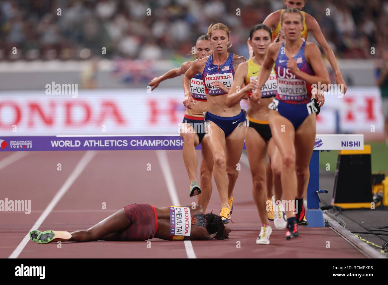 Kaylee Mitchell Peruth Chemutai (UGA) falls causing athletes such as Kaylee Mitchell ...