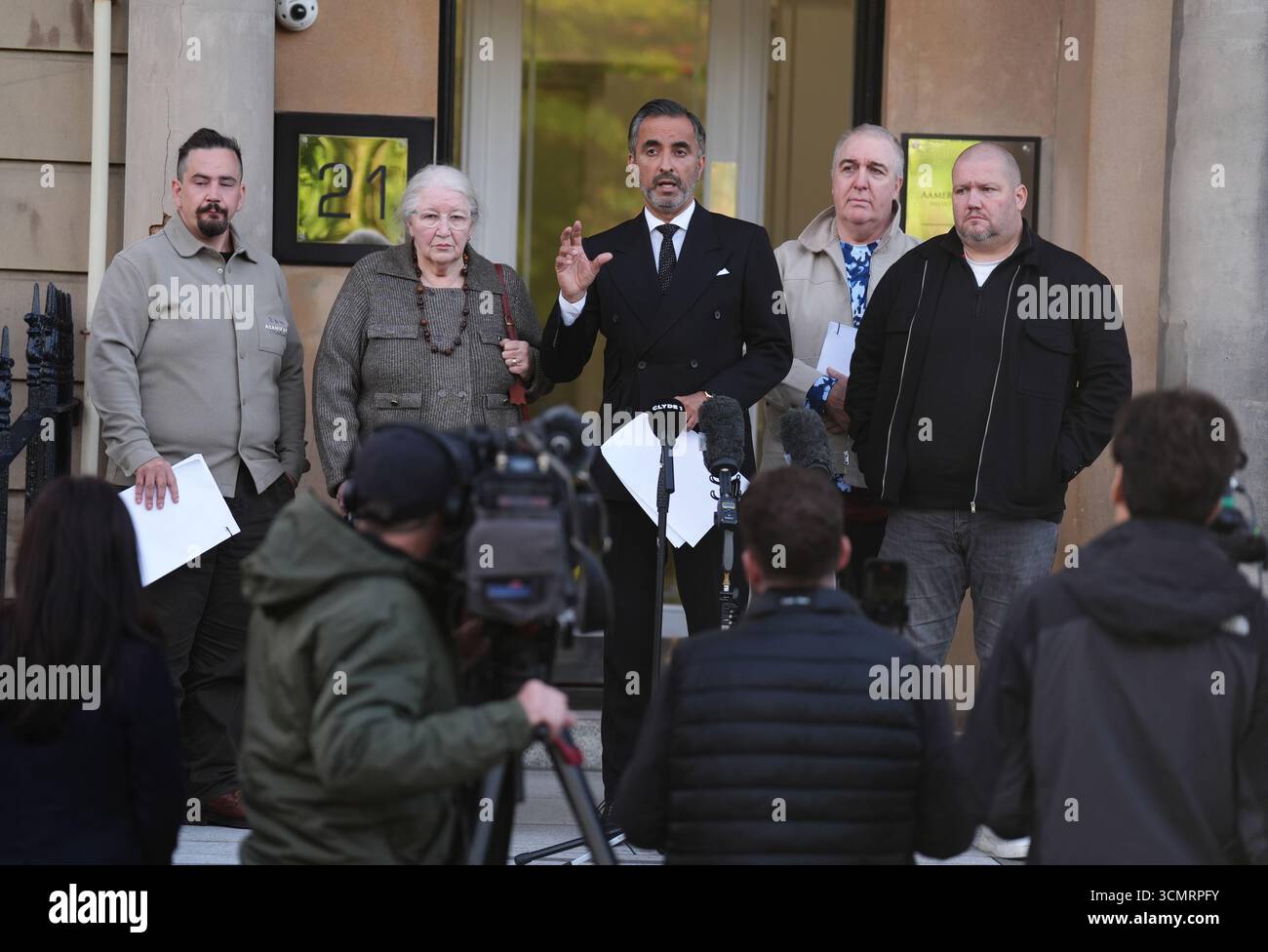 Solicitor Aamer Anwar(c) alongside Margaret Caldwell and family, mother ...