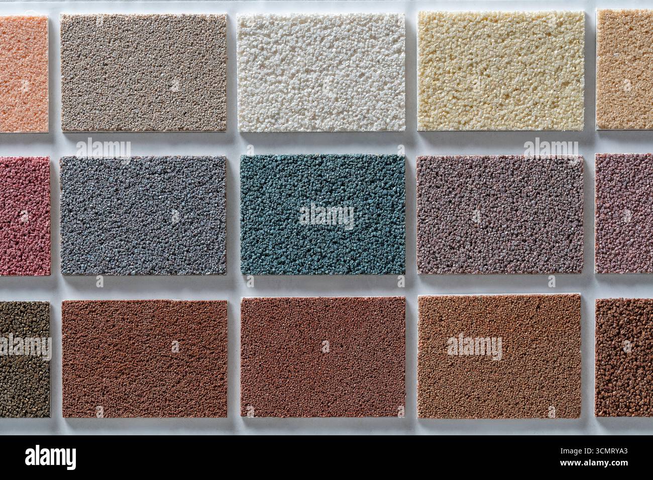 Samples of multi colored plaster for the decoration of the facade and ...