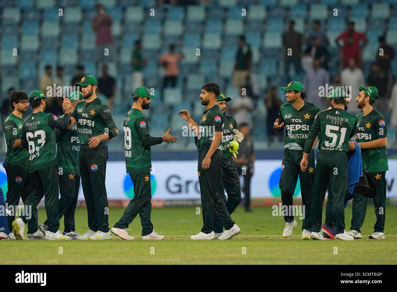 Pakistani players celebrate after defeating United Arab Emirates during ...