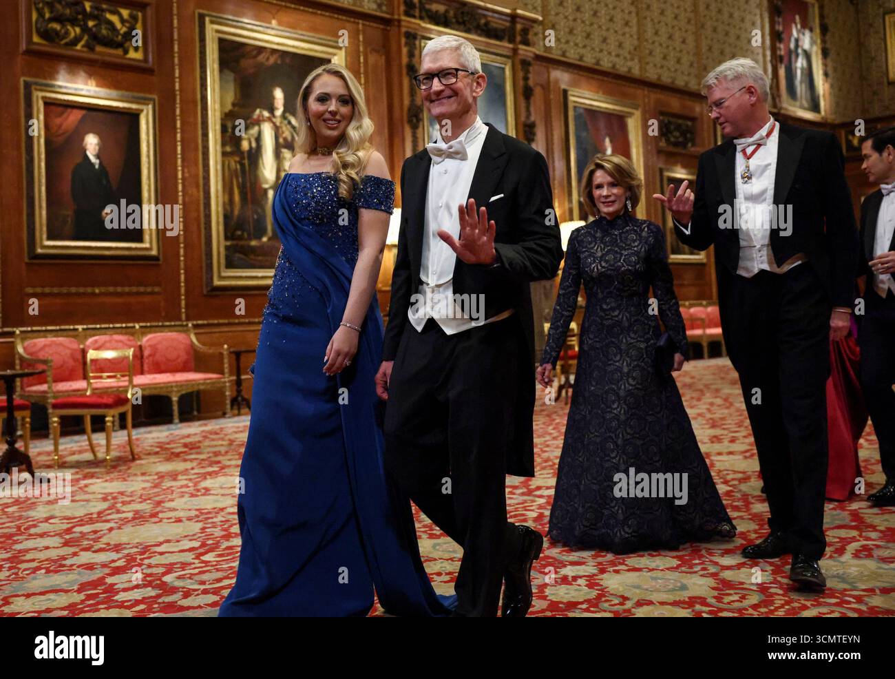 Apple CEO Tim Cook waves as he arrives for a State Banquet at Windsor ...