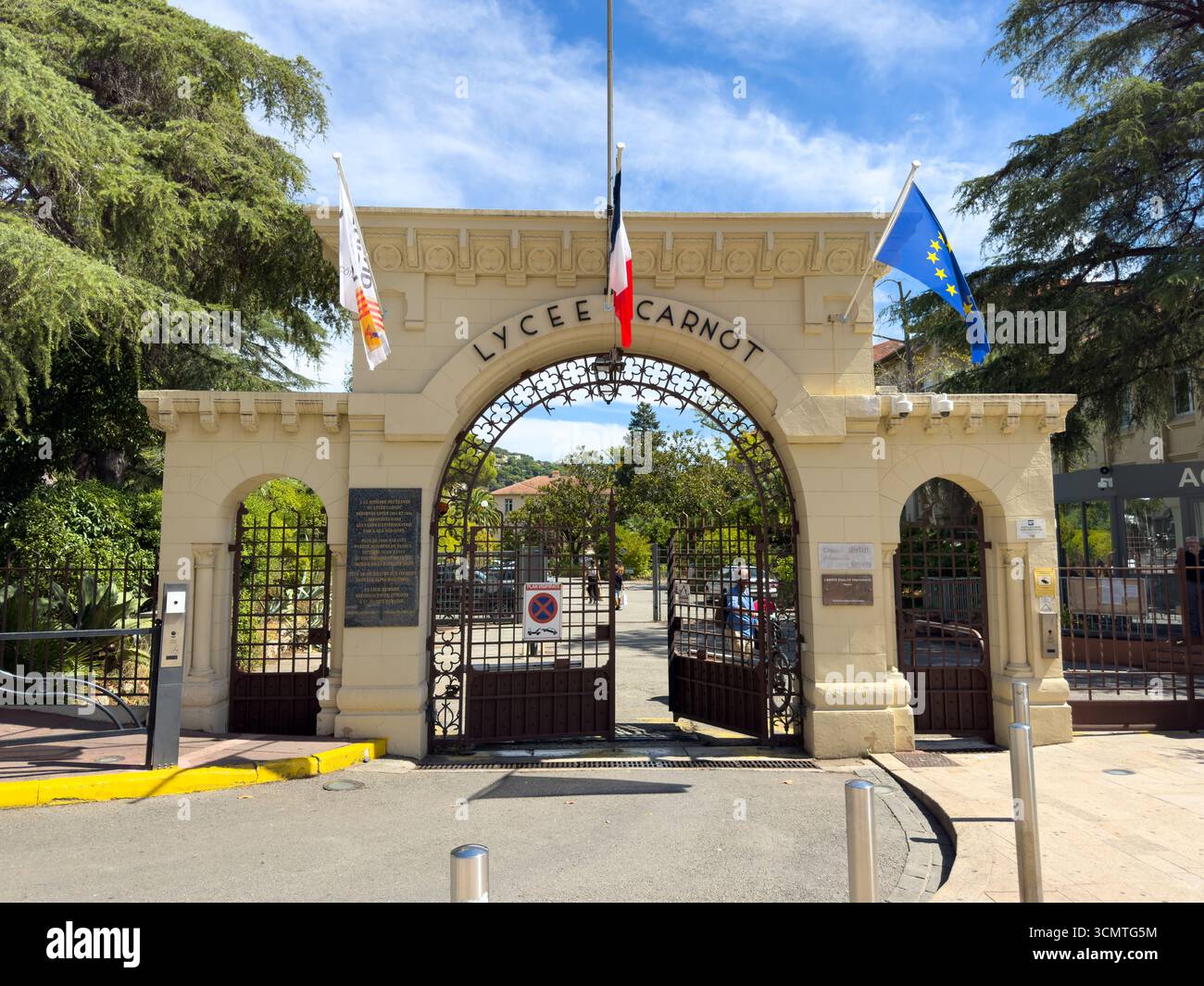 Elegant entrance of Lycee Carnot showcasing historical architecture in a vibrant city setting Stock Photo