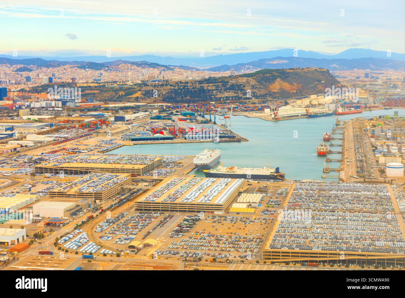 Aerial view of Barcelona port with cargo terminals, ships, and parking ...