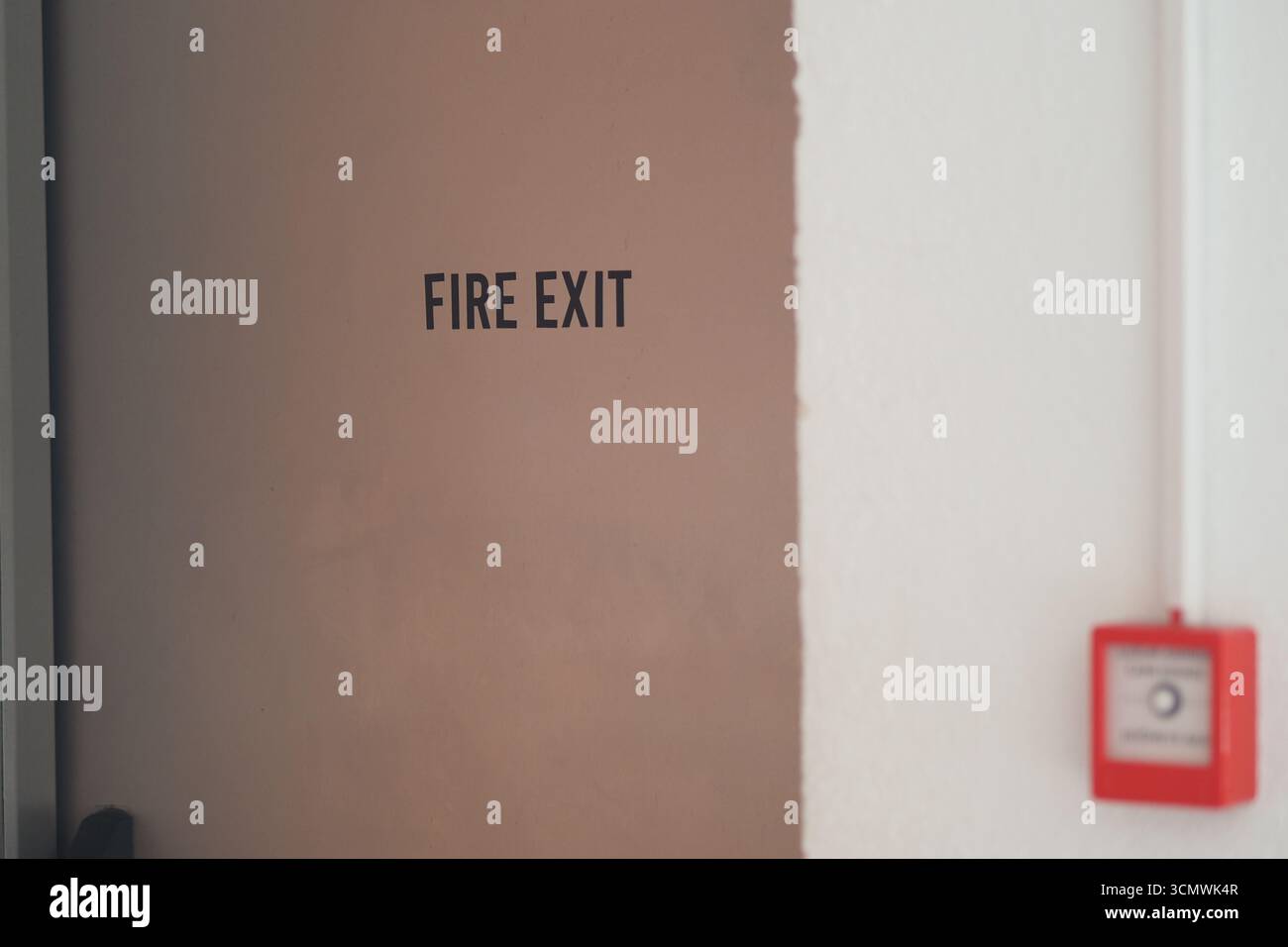 Building Fire Exit Signs Sign marking a fire exit in a building hallway Stock Photo - Alamy