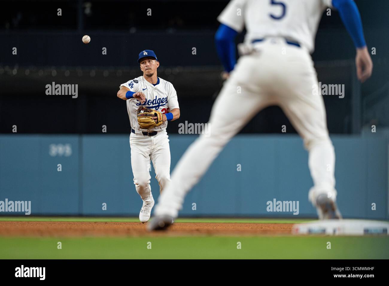 Los Angeles Dodgers second base Tommy Edman (25) throws to first base ...