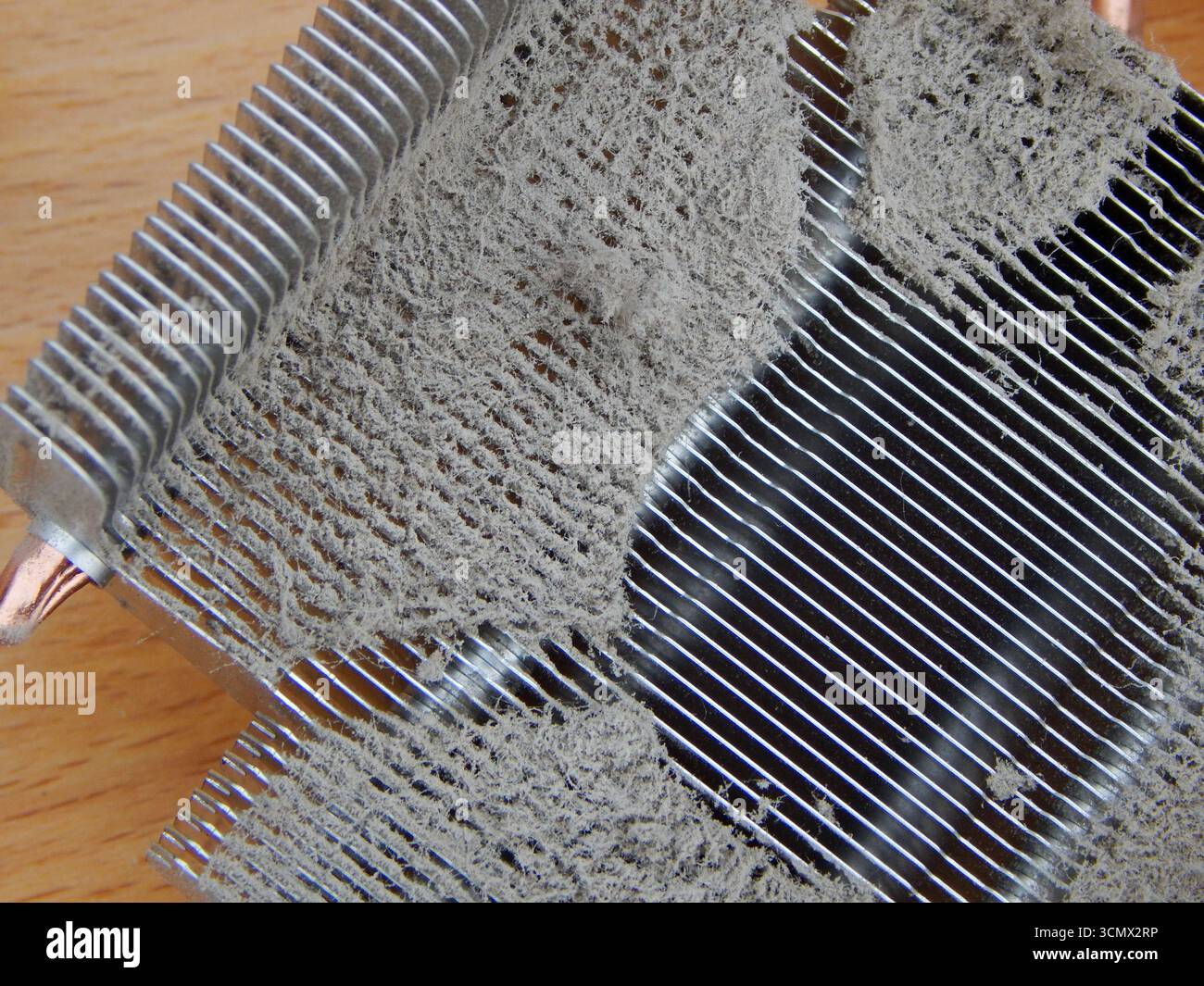 Computer cooler on a radiator covered with dust. Stock Photo
