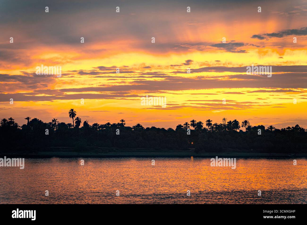 Fiery sky at sunset, Nile River, Egypt Stock Photo