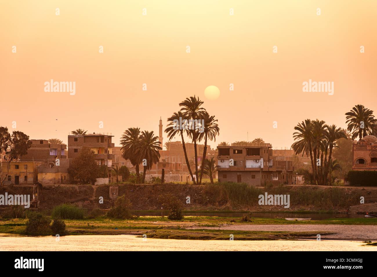 Egyptian village on banks of Nile River, Egypt Stock Photo