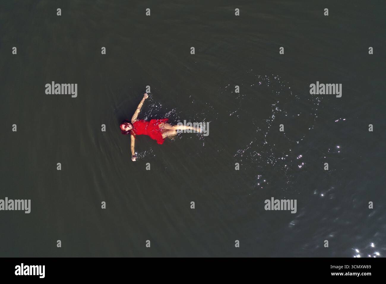 Woman floating dress aerial view hi-res stock photography and images ...