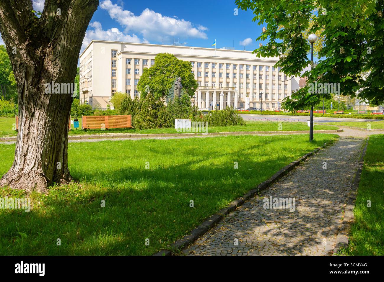 uzhhorod, ukraine - 06 may, 2017: government building of zakarpattia state administration. czechoslovakia architecture and cobblestone street of trans Stock Photo