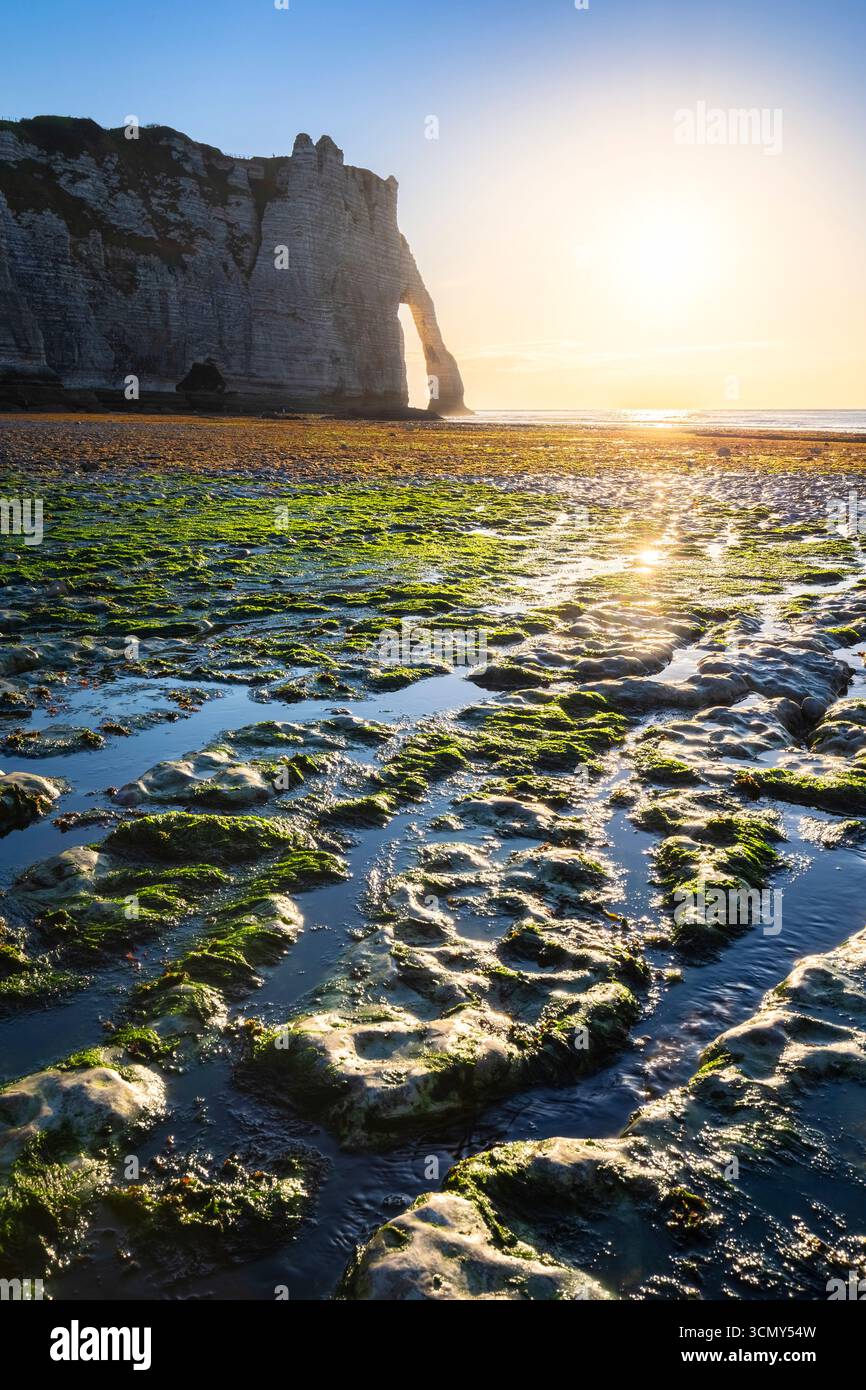 Sunset at the cliff and arch of Etretat, Octeville sur Mer, Le Havre, Seine Maritime, Normandy, France, Western Europe. Stock Photo