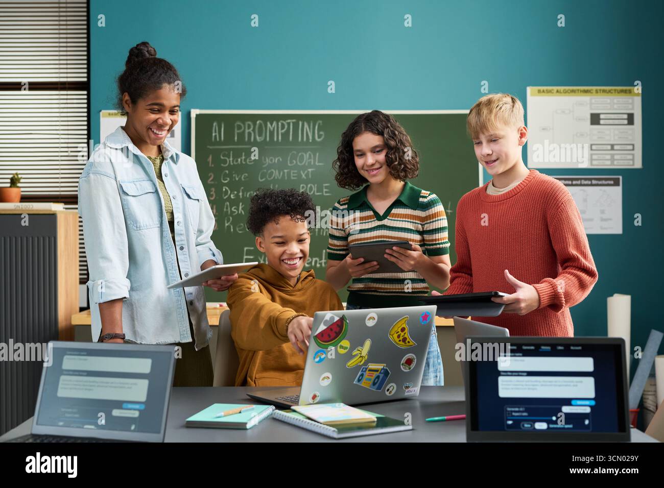 Boy girl laptop teamwork classroom hi-res stock photography and images ...